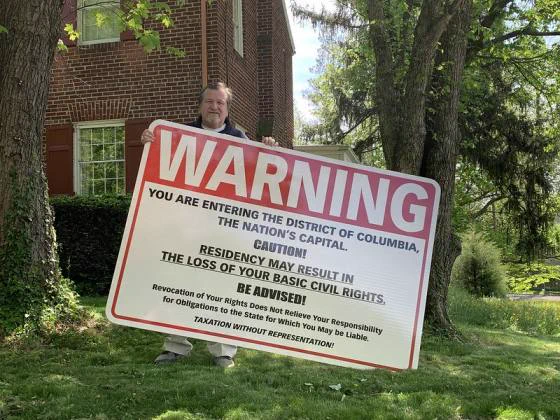 United States Senator Michael D. Brown (D-DC) erected a large reflective, metal “WARNING” sign on the front lawn of his home, located at 4501 Western Avenue, NW in Washington, DC, on May 2, 2021.

Commuters, as they enter DC, encounter his sign stating the fact that residency in the nation’s capital results in the loss of the most basic rights of citizenship.

For details, visit https://statehoodnow.org/2021/05/05/u-s-senator-michael-d-brown-erects-warning-sign-on-his-front-lawn/#more-422.