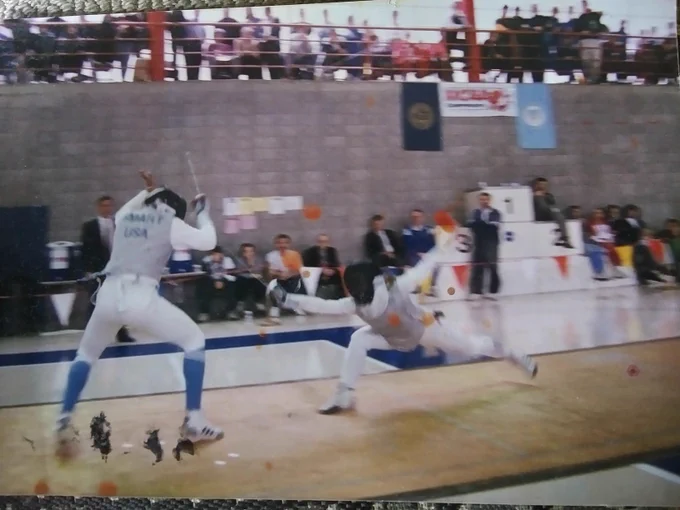 Sara Walsh (right) lunges during an NCAA fencing match.