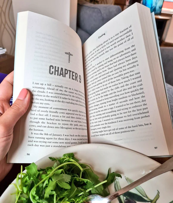 Photo shows book lying open to Chapter 9. The book is sitting in front of a bowl with some salad leaves and a fork.