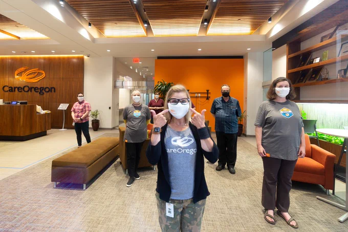CareOregon employees wear masks and practice safe distancing while posing for a portrait