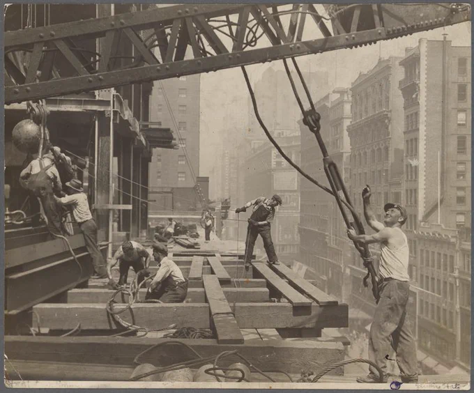 Workers building the Empire State Building