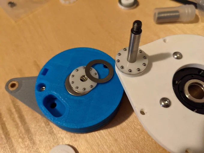 an inside view of the thrust bearings embedded in the lower half of the 5 bar linkage joint