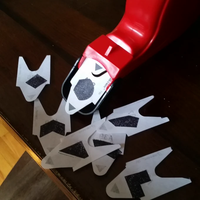 Red "Take a Number" dispenser as you'd see at a deli, with shapes instead of numbers on the tickets.