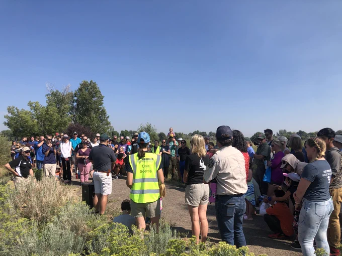 Crowd outside at northern redbelly dace fish release site at Pella Crossing 