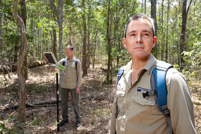 Photo of Paul Roe in the bush looking off camera