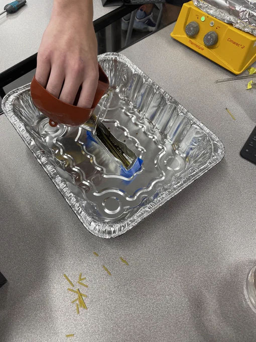Pouring melted candy into the beam mold
