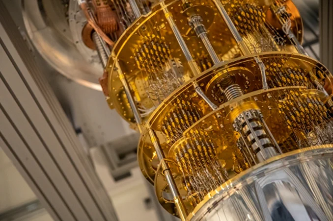 Photo of a quantum computer, which looks like silver disks connected by gold wires