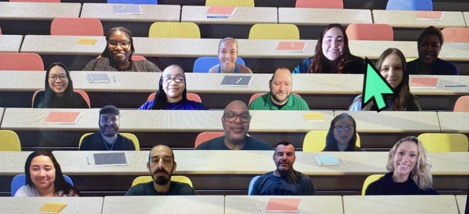Virtual meeting picture of new secondary math teachers with a desk background.