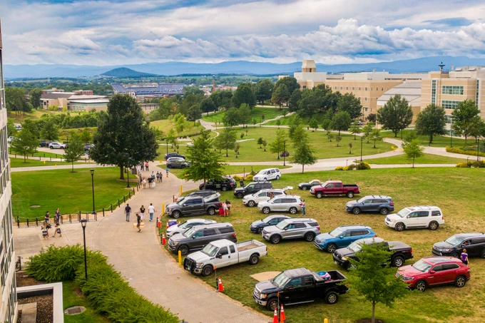 Aerial view of East Campus overlooking cars getting unloading for move-in. 