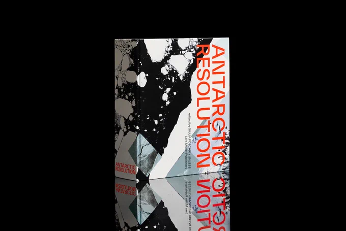 A book with a black and white photo cover and the words "ANTARCTIC RESOLUTION" in bright orange.