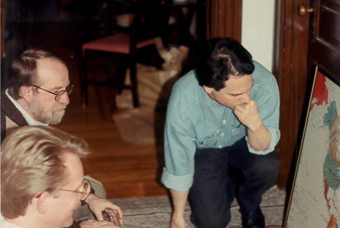 Professor Bert Lockwood examines a map with students.