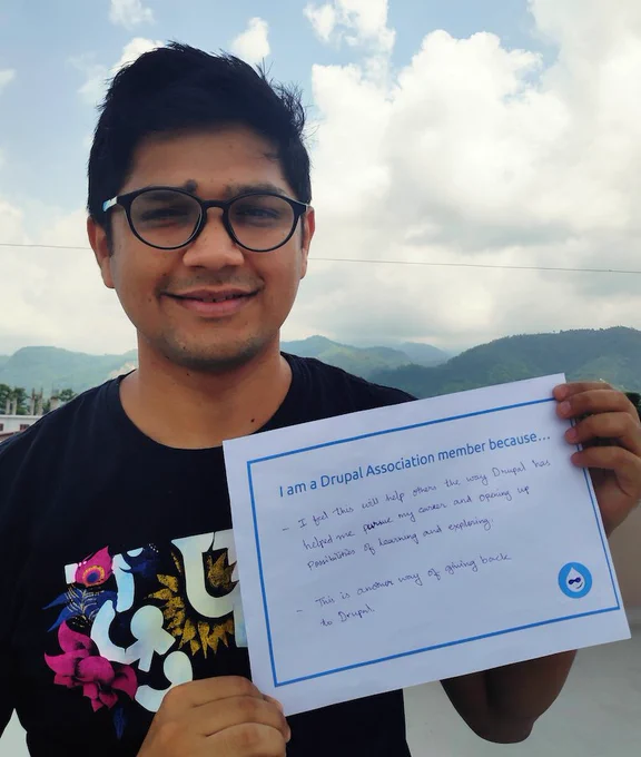 Jaideep holding a sign with words on why they are a member.