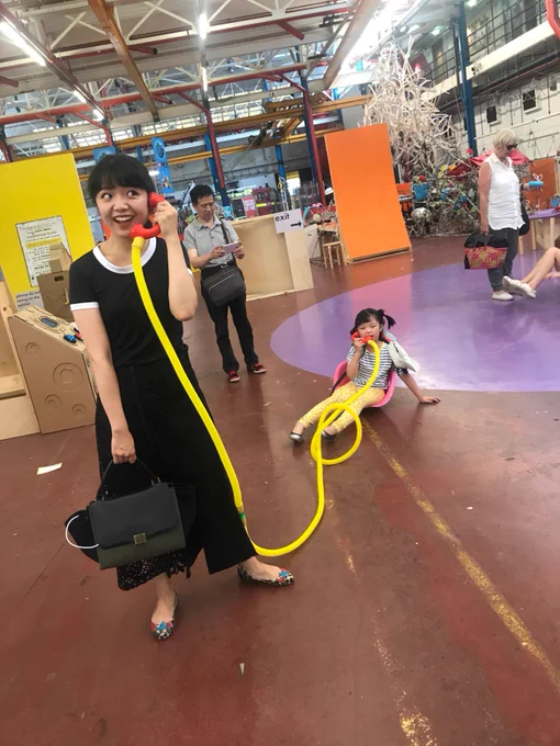 Mum and daughter making phone call at mega maker lab