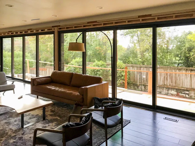 Transformative. Grandview Multislides full finish Anthracite. Installed by our partners at Ryzer Sales & Contracting

#custompatiodoors #multislides #painted #vinyl #performance #fenestration #patioopenings
