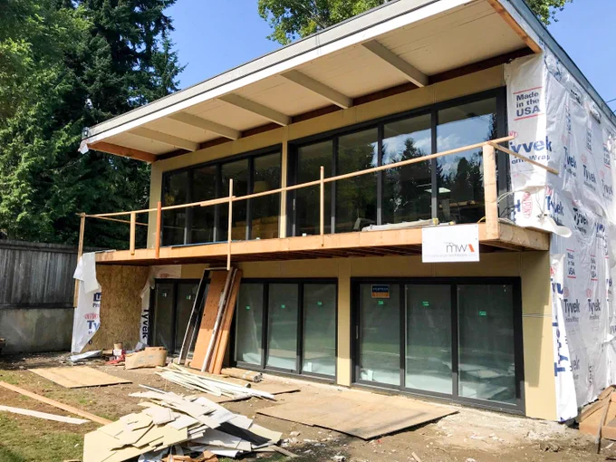 Transformative. Grandview Multislides full finish Anthracite. Installed by our partners at Ryzer Sales & Contracting

#custompatiodoors #multislides #painted #vinyl #performance #fenestration #patioopenings
