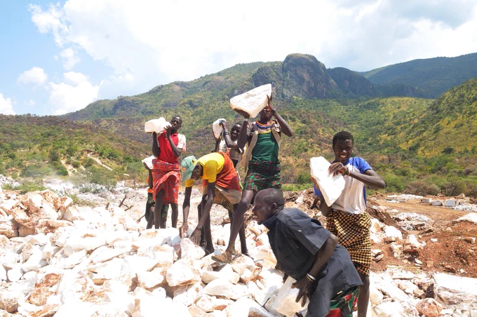 Members of the Lopsik Mining group in Lupa Moroto at work. The group mines marble and breaks it into smaller pieces for the local market. The group is one of the projects supported by UNDP in Karamoja sub-region in the recent past. It is mainly composed of the Youth and Women.
