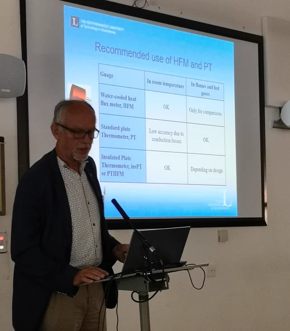 man presenting powerpoint slides on heat flux measurements