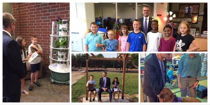 Far left picture- Johnny Collett speaks with two elementary school students as they describe their indoor garden. Top Right pic- Johnny Collett poses with seven of Ms. Hart’s students. Bottom Right Pic – Collett pets Therapy Dog Riley. Center Pic – Johnny Collett sits with two students outside on a bench dubbed the buddy bench.