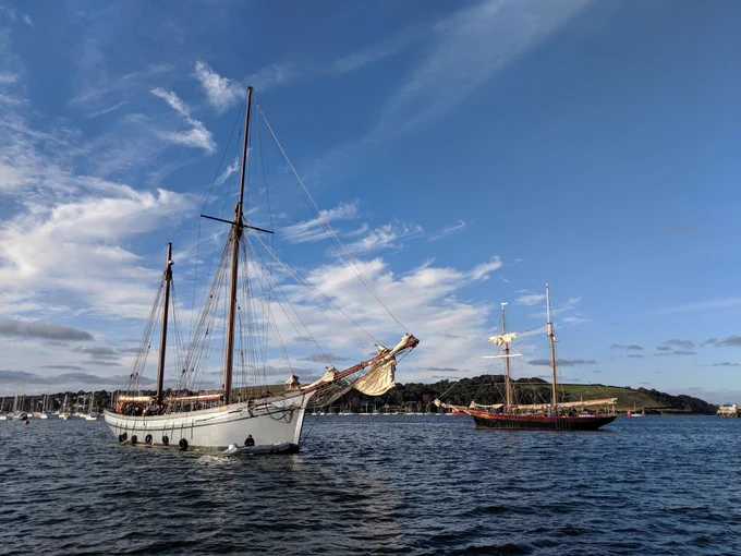 Traditional sailing ketch Irene circles around topsail schooner Johanna Lucretia and approaches the pontoon in Falmouth