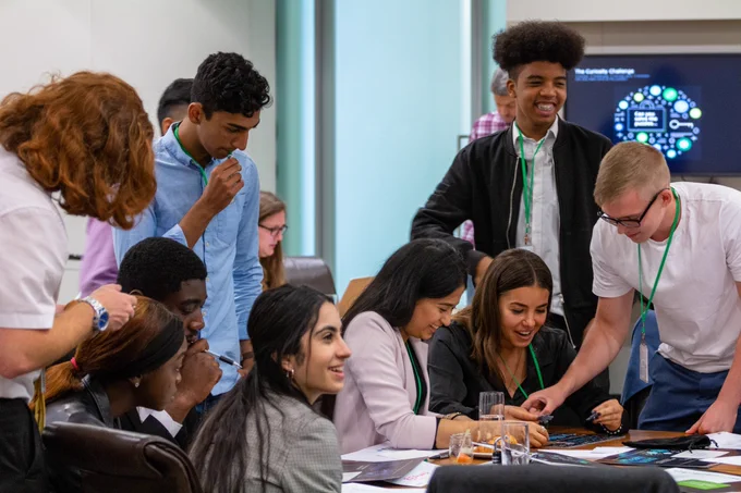 A group of students working on a puzzle