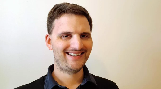 James smiles at the camera