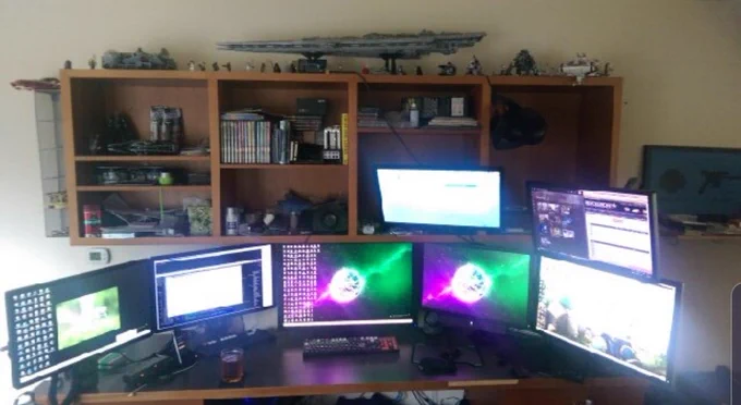 Husband's home computer setup with 7 screens