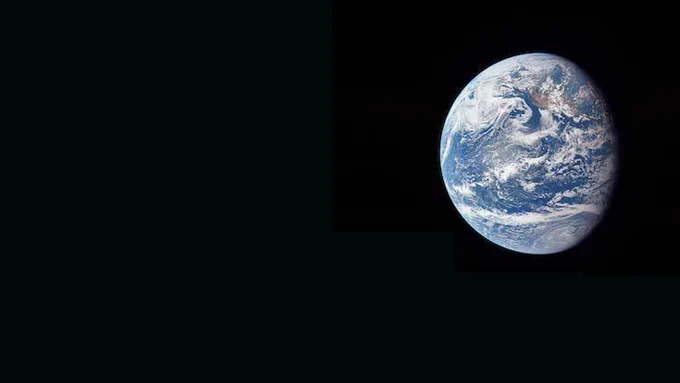 Earth seen in the dark of space (from the moon).