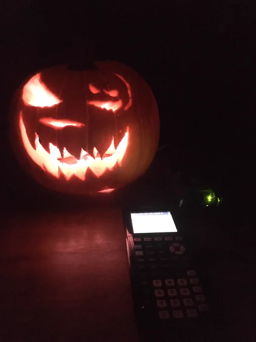 A 🎃 lit up through code on a TI Calculator