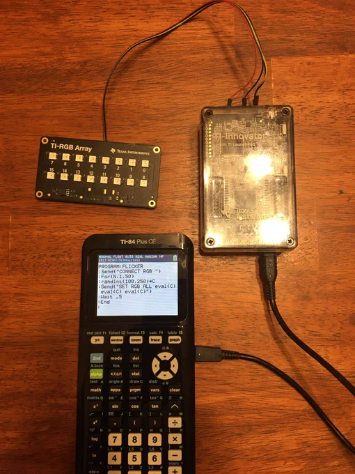 A TI-84 Plus CE connected to a TI Innovator Hub and a TI-RGB Array