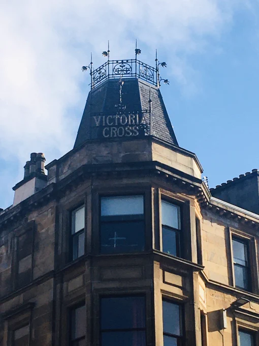 Photo of Victoria cross on corner of Victoria and Allison street in Govanhill