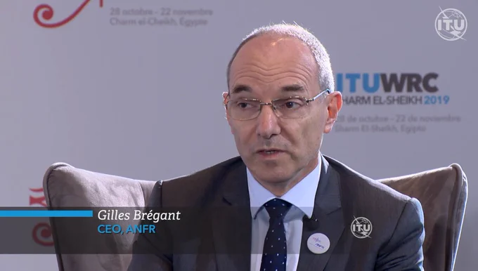 Gilles Brégant, CEO of ANFR, sits in the ITU WRC TV Studio for a video interview