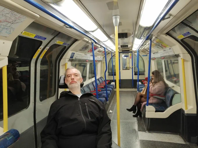 Alan in a nearly empty tube carriage