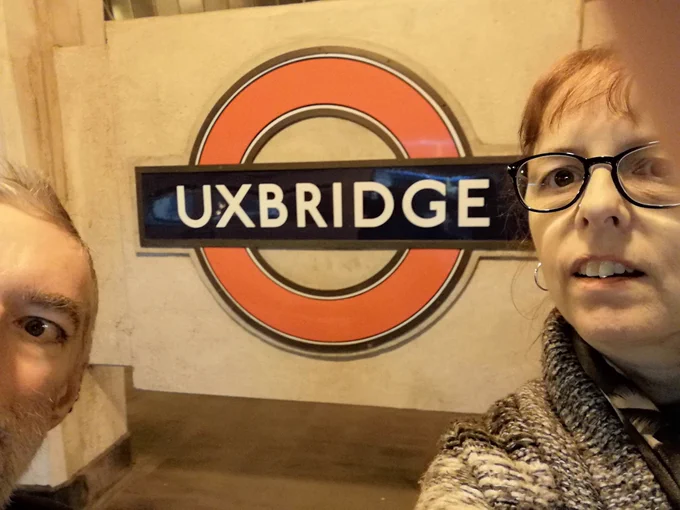 Alan and Yvonne looking wiped out in front of the Uxbridge station sign.