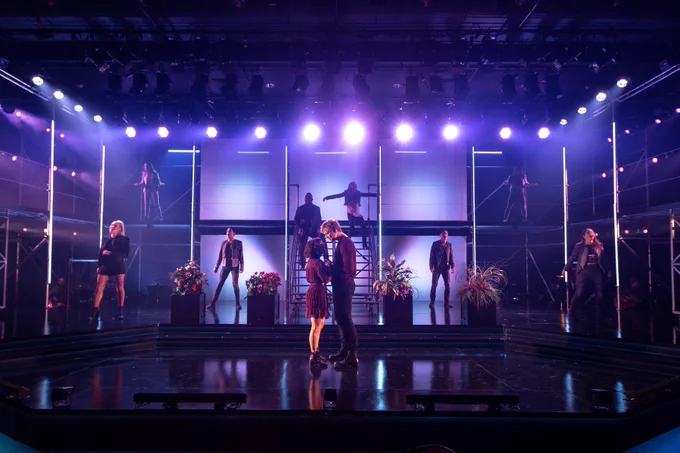 The full cast of Mythic in their final positions of the show. Hades and Persephone almost kiss in the centre of the frame. 
