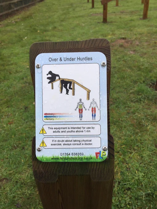 Info board describing how to use the up and over hurdles at Bardwell Community Field