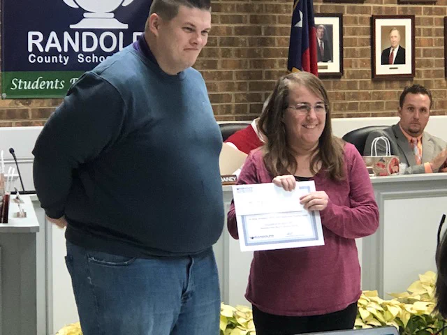 Media Specialist receives grant certificate.