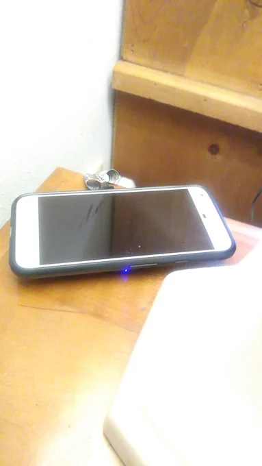My Pixel XL is equipped with a Qi wireless charging card under the case and the charger shows it is charging, but no on screen charging info and the power button is useless.