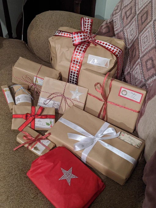 Wrapped brown paper presents with ribbons.