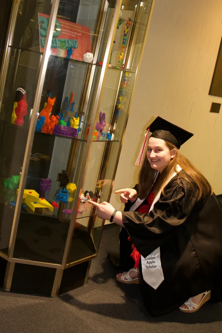student pointing at a replica of her Royal Game of Ur pieces