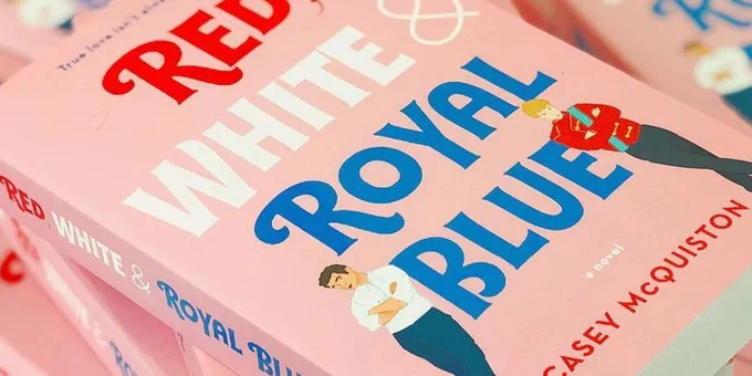 A stack of Casey McQuiston's novel Red, White & Royal Blue