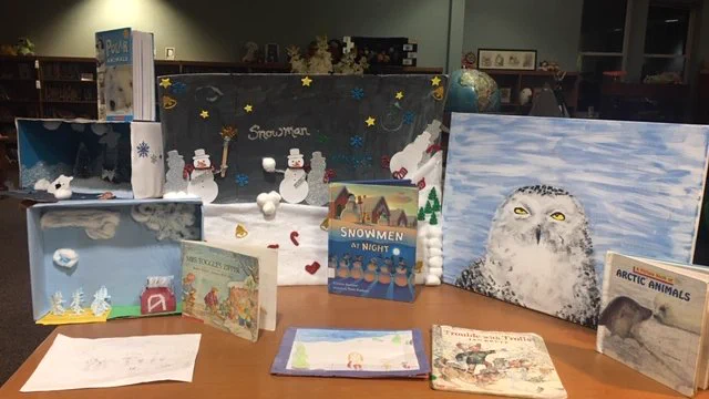 These book displays were created by students based on a book they were given during Reading Night.