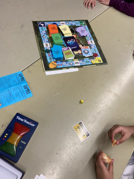 Math ops game board on table with timer