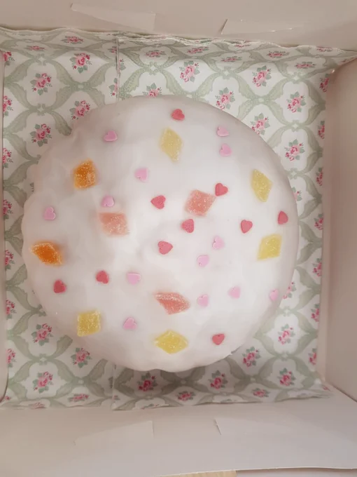Cake with white icing and decorations on the top