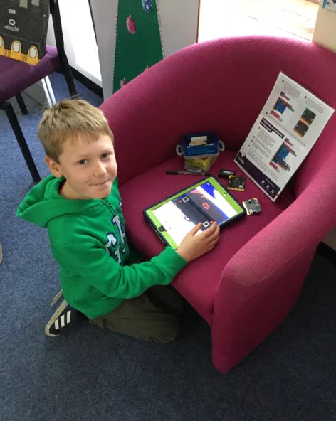 Boy doing iPad coding with micro:bits