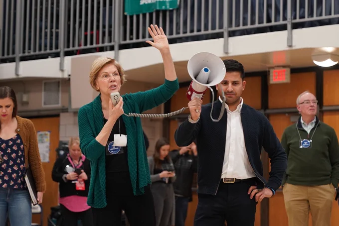 Elizabeth Warren addresses a crowd of caucusgoers in Des Moines.