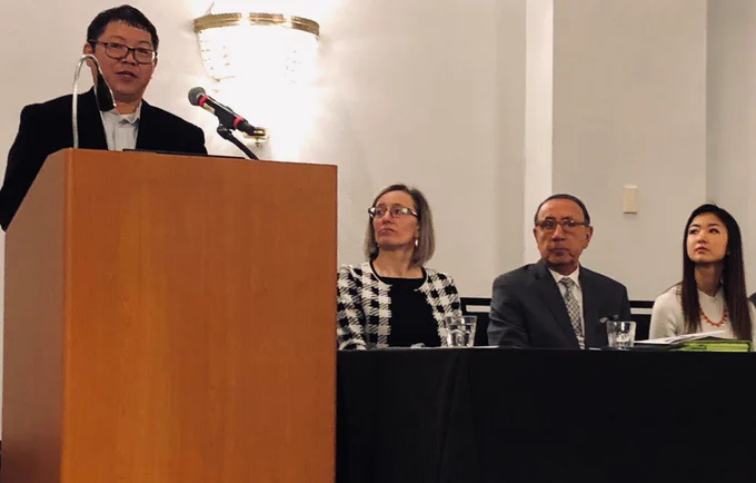 Jansen Hang speaking at podium at DNR roundtable.