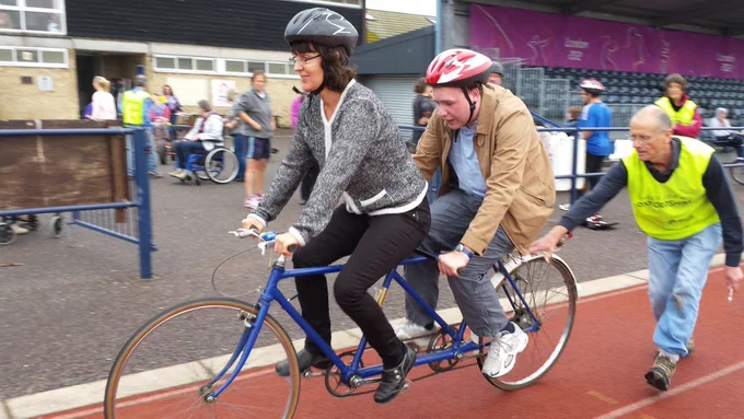 two people riding a tandem 