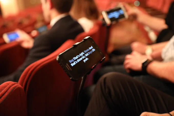 Phone with dialogue on it at the theatre. 