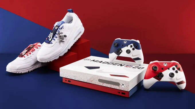 A limited-edition Nike/Madden 20 themed Xbox One X, red and blue Xbox One controllers, and a custom pair of Nike shoes are placed next to each other on a blue and red background.