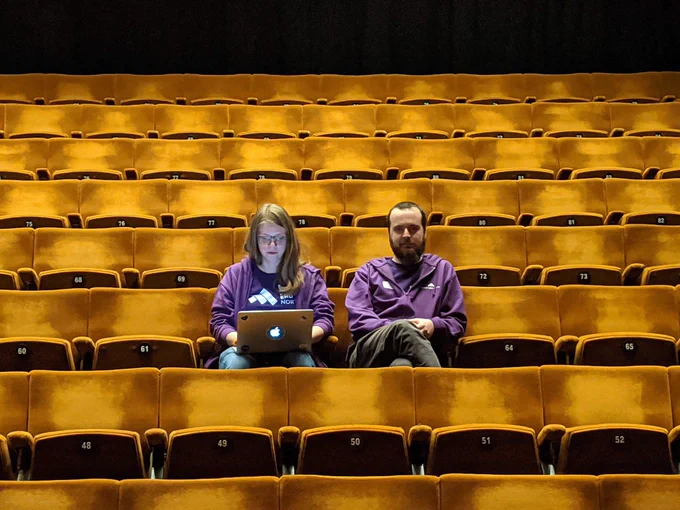 Conference organiser Amy and volunteer Gareth in the seats at The Crucible